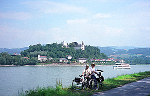 Cyclists pose along the Danube River